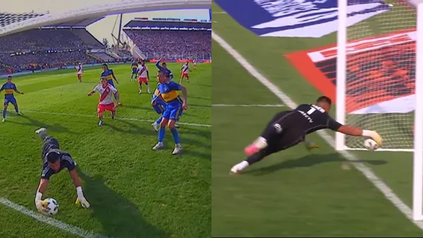 Romero evita con su mano que la pelota entre dentro de su arco en Boca.