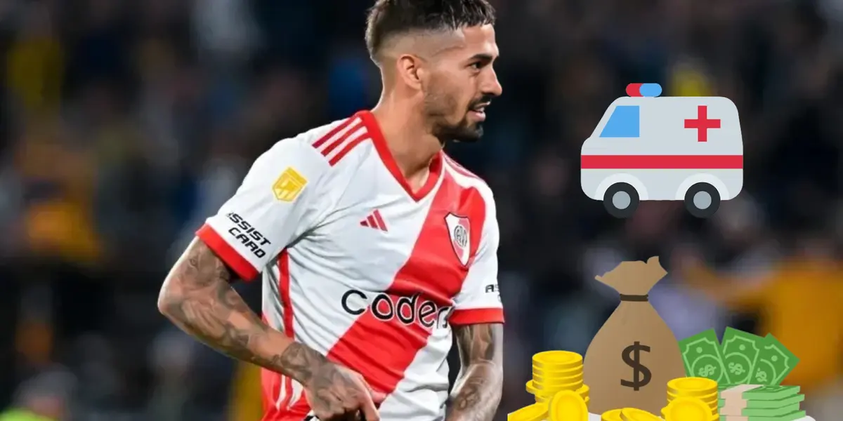 Manuel Lanzini tomándose su pierna tras una lesión.